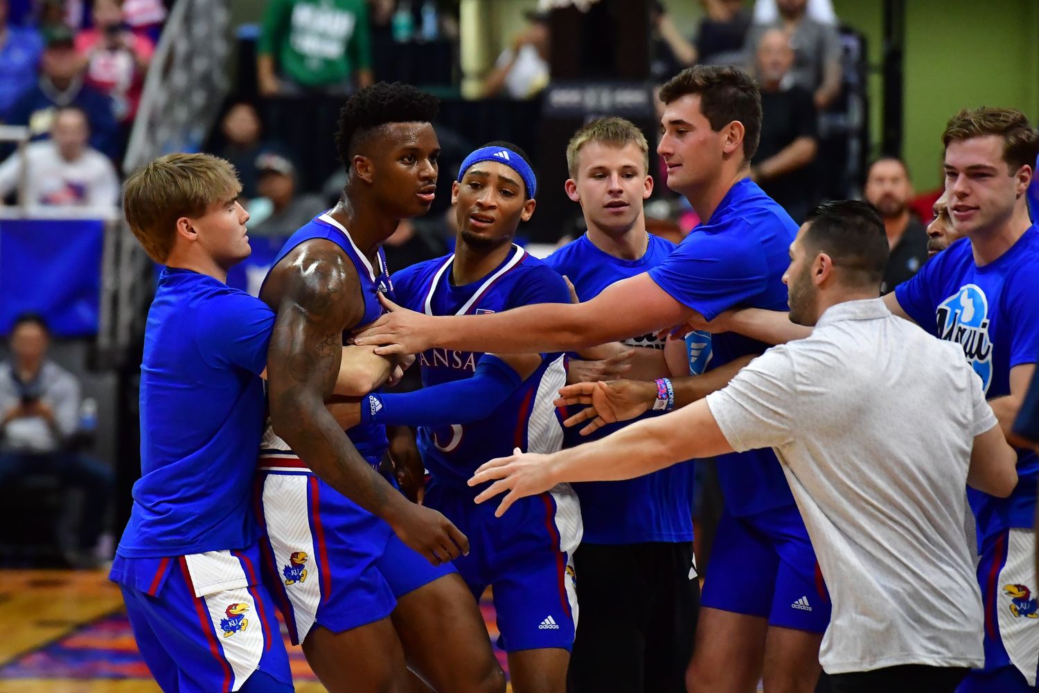Nov 21, 2023; Honolulu, HI, USA; Players from Kansas Jayhawks and Marquette Golden Eagles became involved in a courtside disagreement during the first period at SimpliFi Arena at Stan Sheriff Center. Mandatory Credit: Steven Erler-USA TODAY Sports  